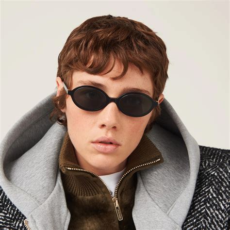 Miu Miu MU 04ZS Sunglasses .